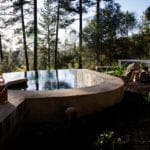 two glasses of wine with sitting by the hot tub