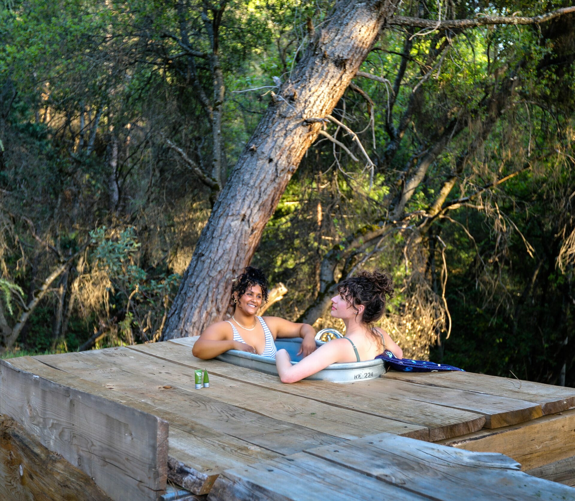 Reverie Retreat two women in the outdoors hot tub
